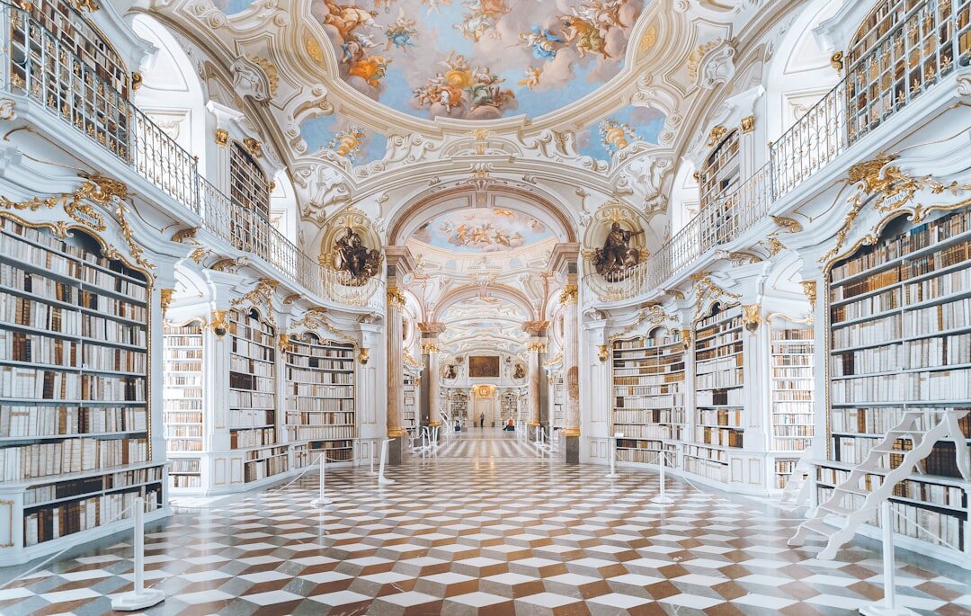 Old library with tall bookshelves filled with novels