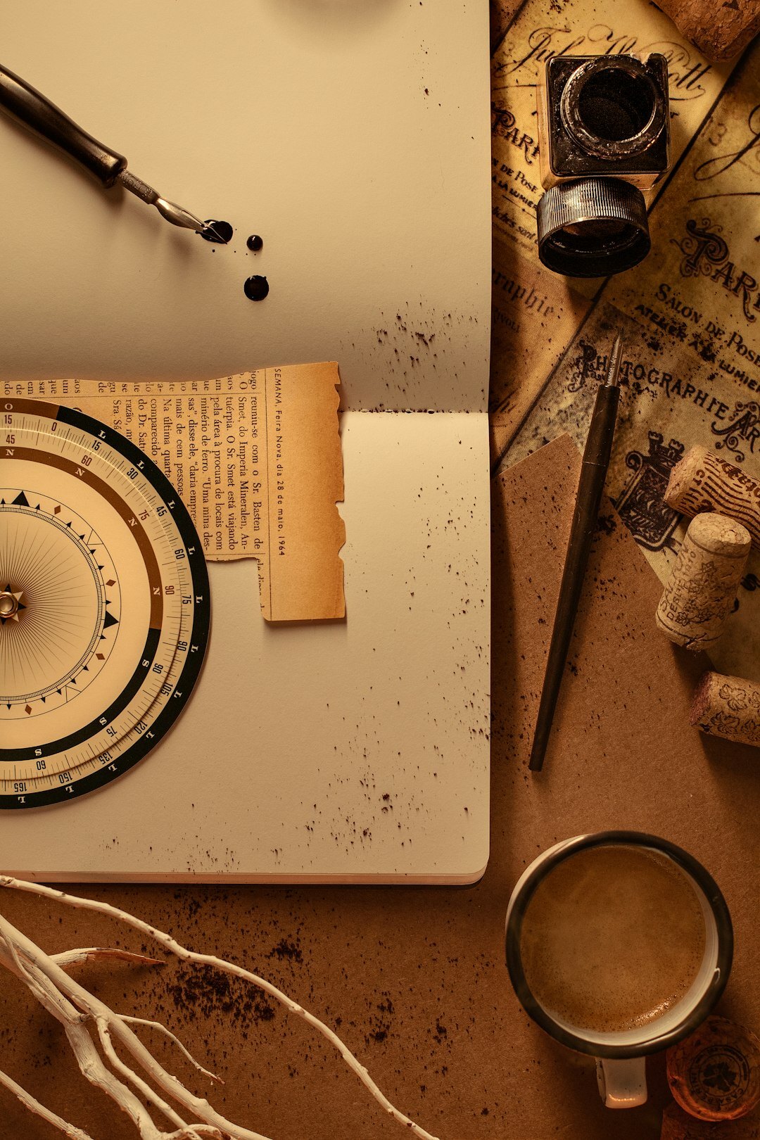Vintage writing desk with typewriter, magnifying glass and notebook